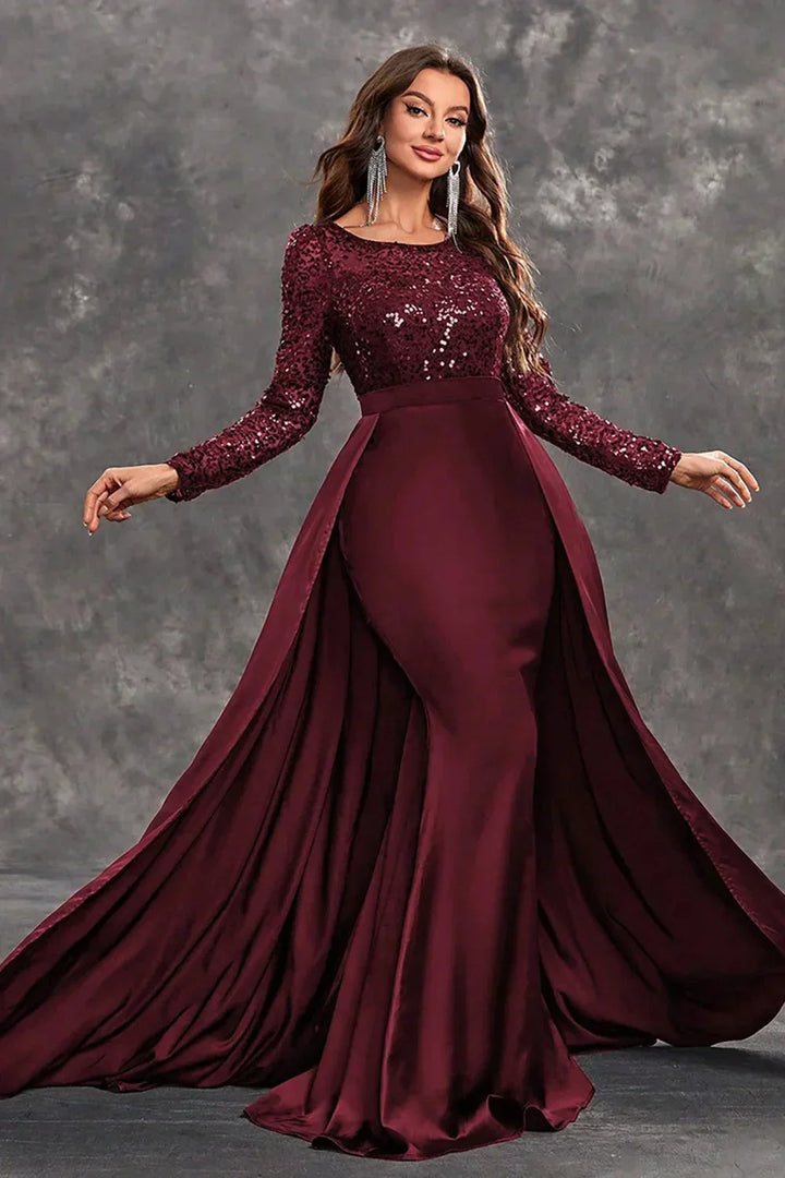 Robe soirée longue en tissu fluide, ornée de sequins, avec une jupe évasée pour un confort et un mouvement élégants.