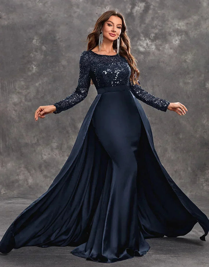 Robe longue soirée en tissu fluide, ornée de sequins, avec une jupe ample et légère pour une silhouette élégante.
