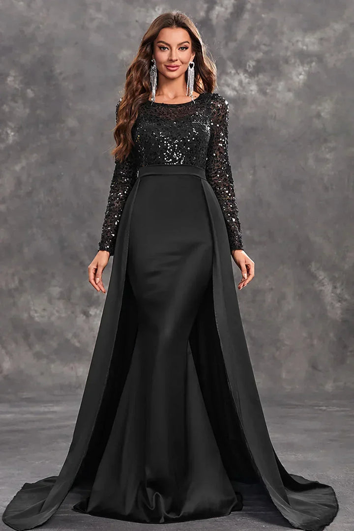 Robe soirée longue noire en tissu fluide, ornée de sequins brillants, à jupes légères pour un look élégant.