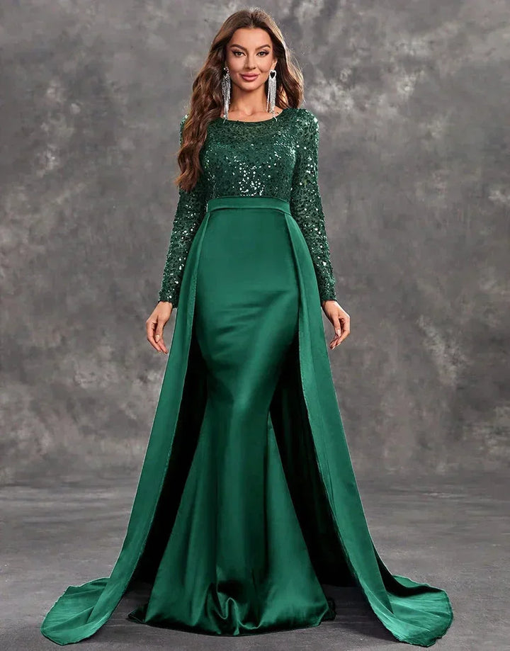 Robe soirée longue verte en satin avec sequins et jupe fluide, parfaite pour des occasions spéciales.