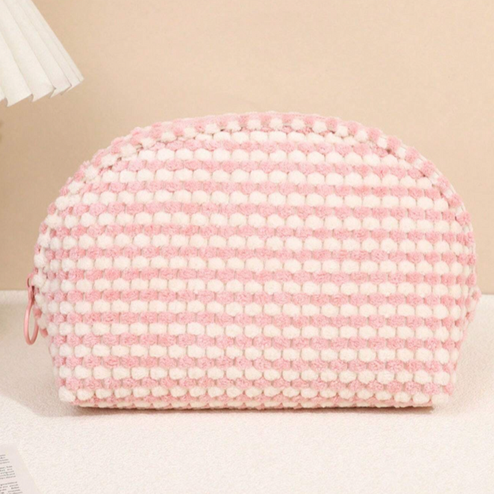 Borsa cosmetica rosa e bianca a righe, tessuto intrecciato, design elegante, ideale per trucco e accessori, perfetta per viaggi e uso quotidiano.