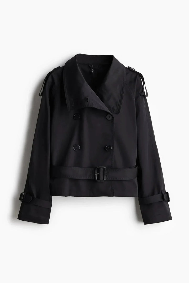 Trench-coat femme avec col montant, ceinture nouée et tissu en coton mélangé.
