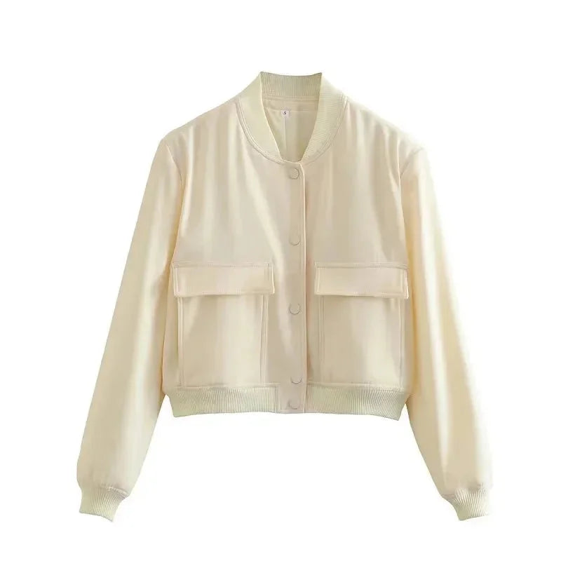 Veste bomber femme bleu marine en polyester léger, avec poches frontales et poignets élastiques.