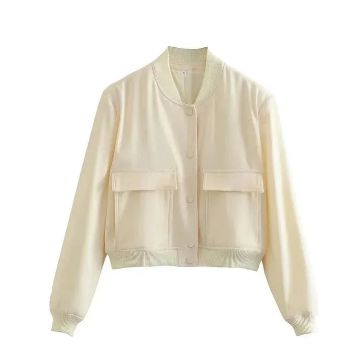 Veste bomber femme bleu marine en polyester léger, avec poches frontales et poignets élastiques.