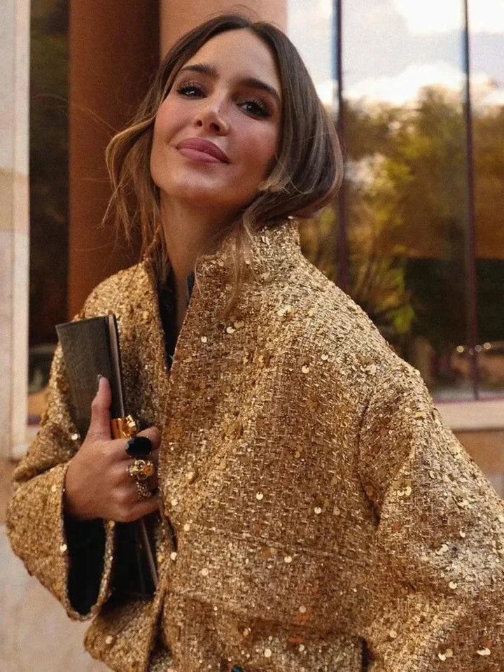 Veste femme noire à paillettes, coupe ajustée, idéale pour les occasions festives.