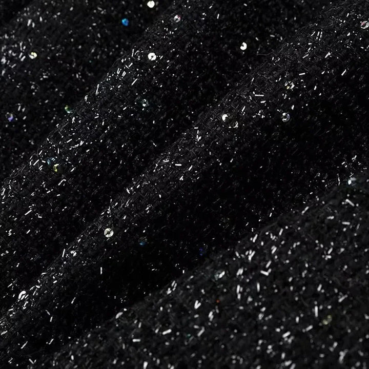 Veste femme à paillettes, coupe ajustée, tissu léger, idéale pour des occasions élégantes.