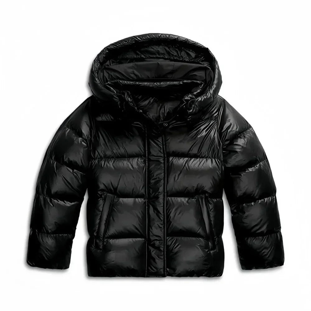 Veste matelassée bleue pour femme, avec capuche, isolée, conçue pour les jours froids, coupe moderne et confortable.